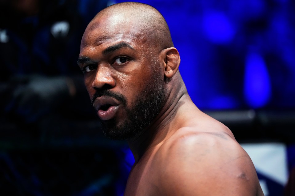 Jon Jones entering the octagon at a UFC event.