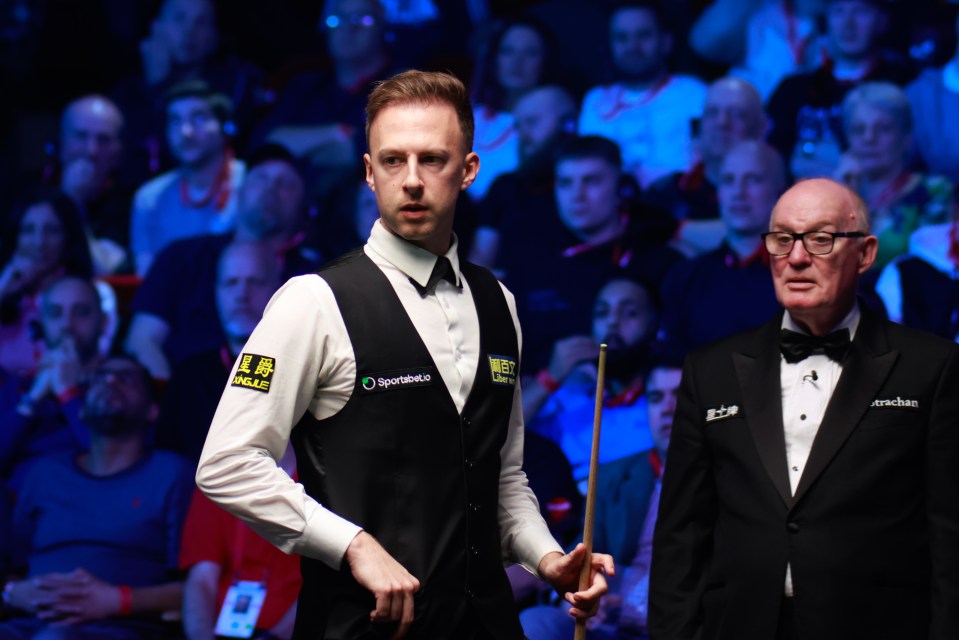 Judd Trump of England reacts during a snooker match.