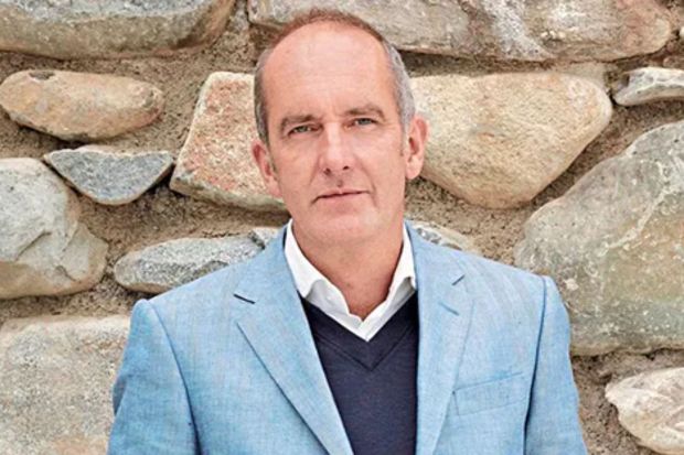 An image collage containing 1 images, Image 1 shows Portrait of Kevin McCloud in front of a stone wall