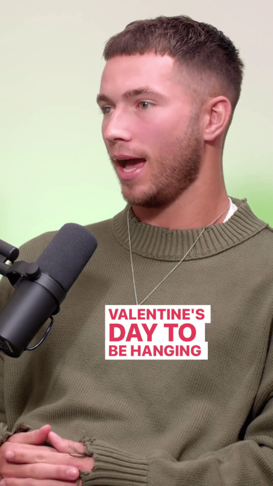 Ron Hall, Love Island All Stars contestant, speaking into a microphone.  Text overlay reads "Valentine's Day To Be Hanging".