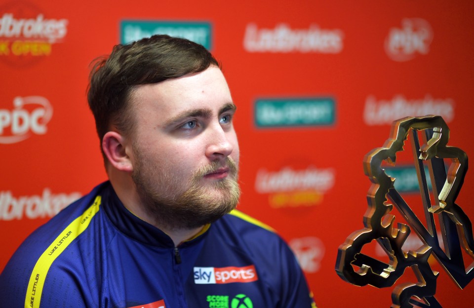 Luke Littler at a sports event.