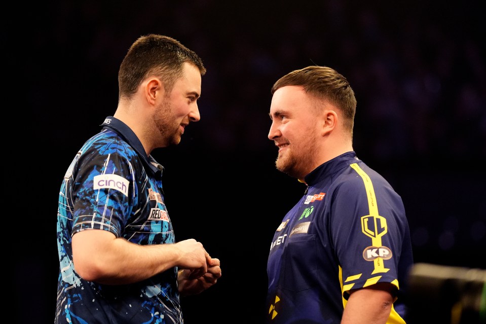 Luke Humphries and Luke Littler at a darts match.