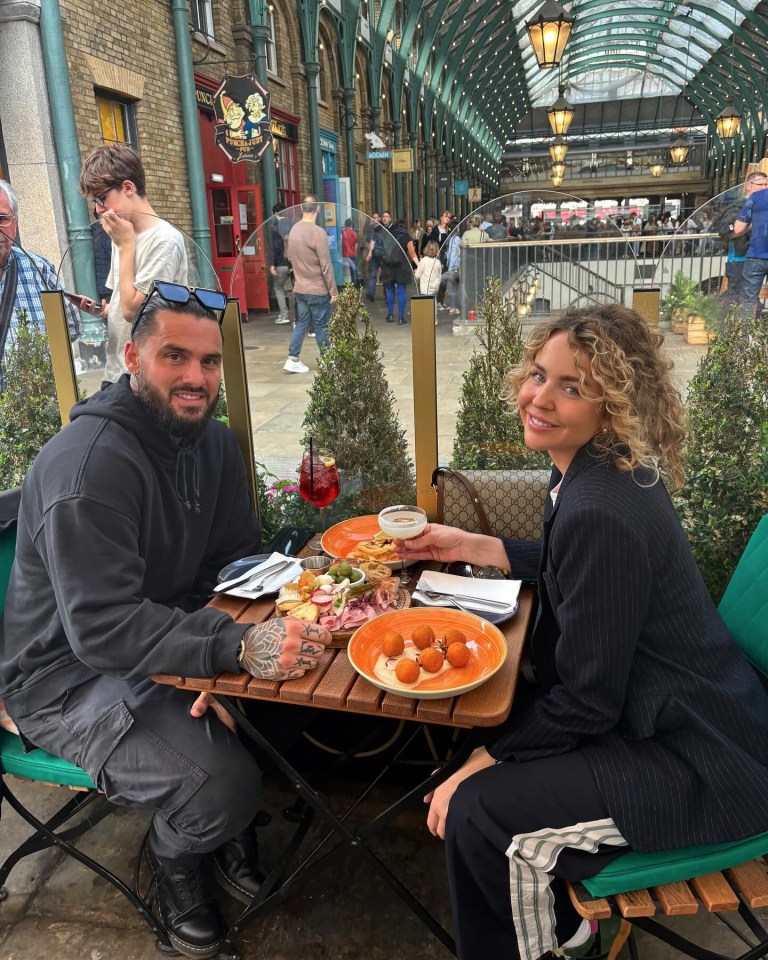 Couple enjoying a meal outdoors.