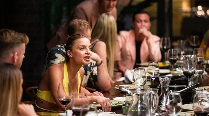 A group of people at a dinner party.