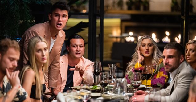 A group of people at a dinner party.