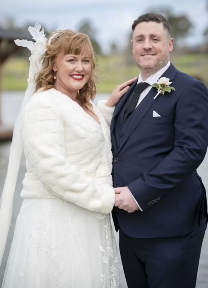 A bride and groom holding hands.