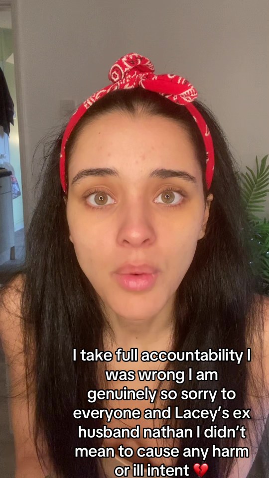 Woman wearing a red bandana apologizes for spreading false accusations.