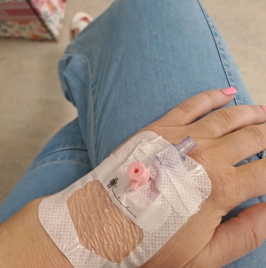 Woman's hand with an IV.