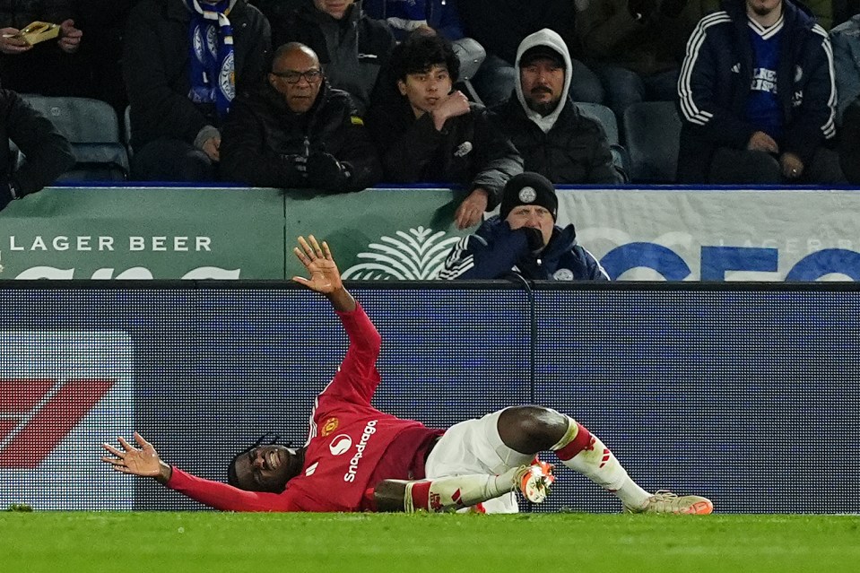 Manchester United's Ayden Heaven injured on the field.