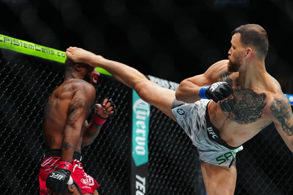 Mauricio Ruffy knocking out Bobby Green with a wheel kick at UFC 313.