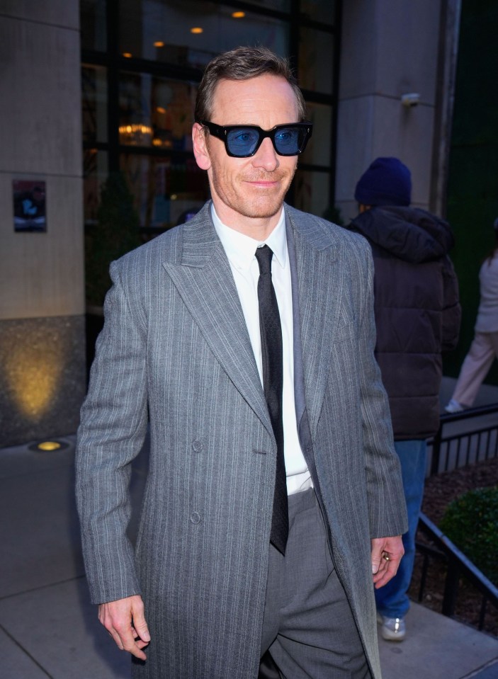 Michael Fassbender walking down the street.
