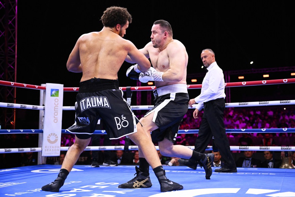 Moses Itauma knocks down Istvan Bernath in a boxing match.