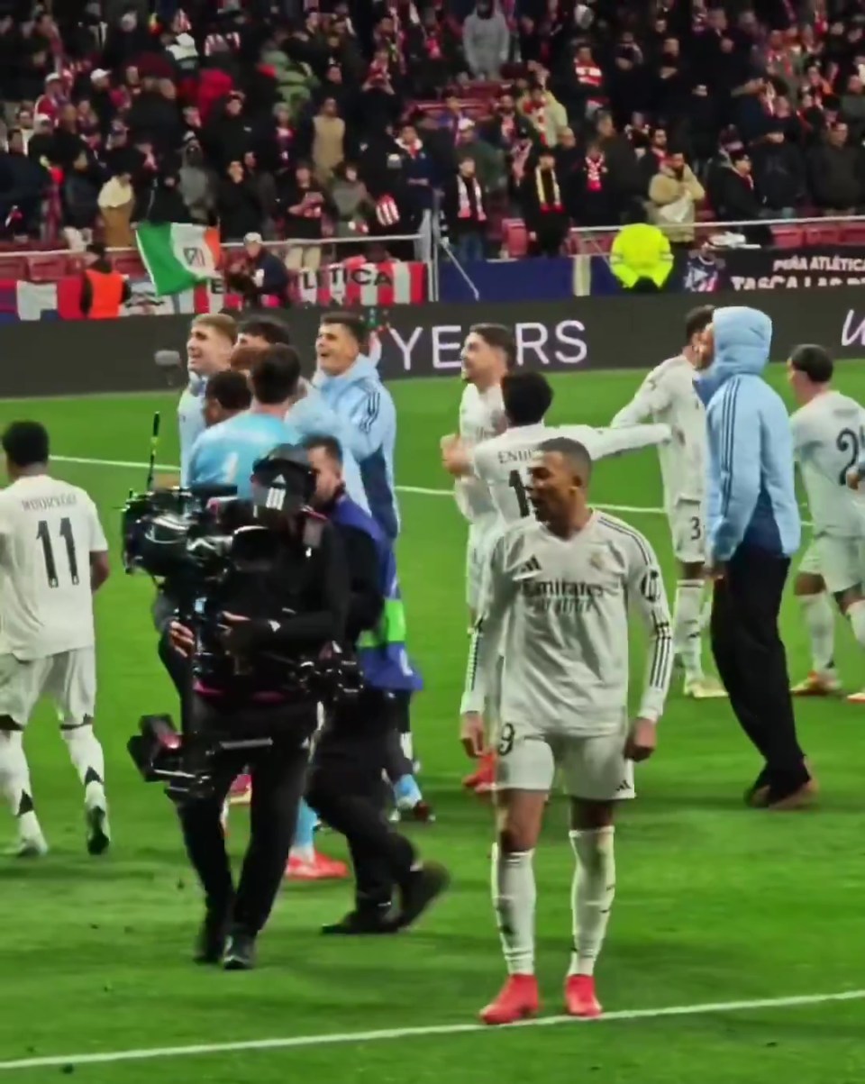 Footage of Kylian Mbappé on the field after a soccer match.