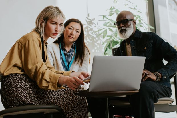 An image collage containing 1 images, Image 1 shows Three colleagues looking at a laptop together