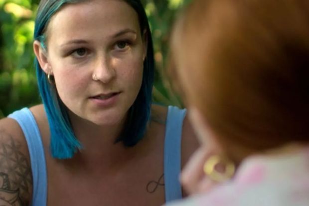 An image collage containing 1 images, Image 1 shows Woman with blue hair confides in another woman