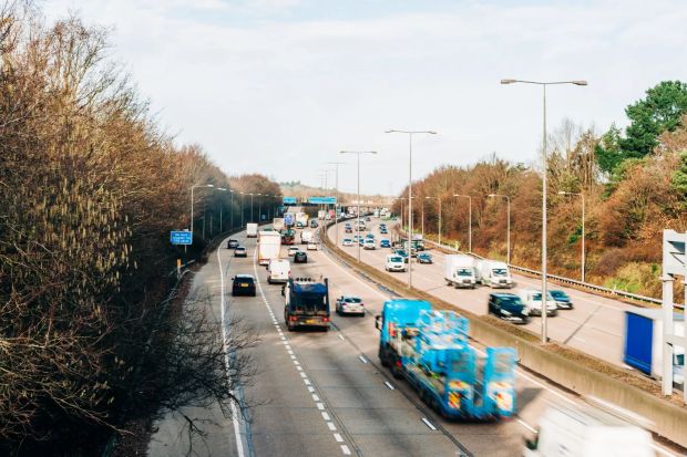 An image collage containing 1 images, Image 1 shows Traffic on a multi-lane highway