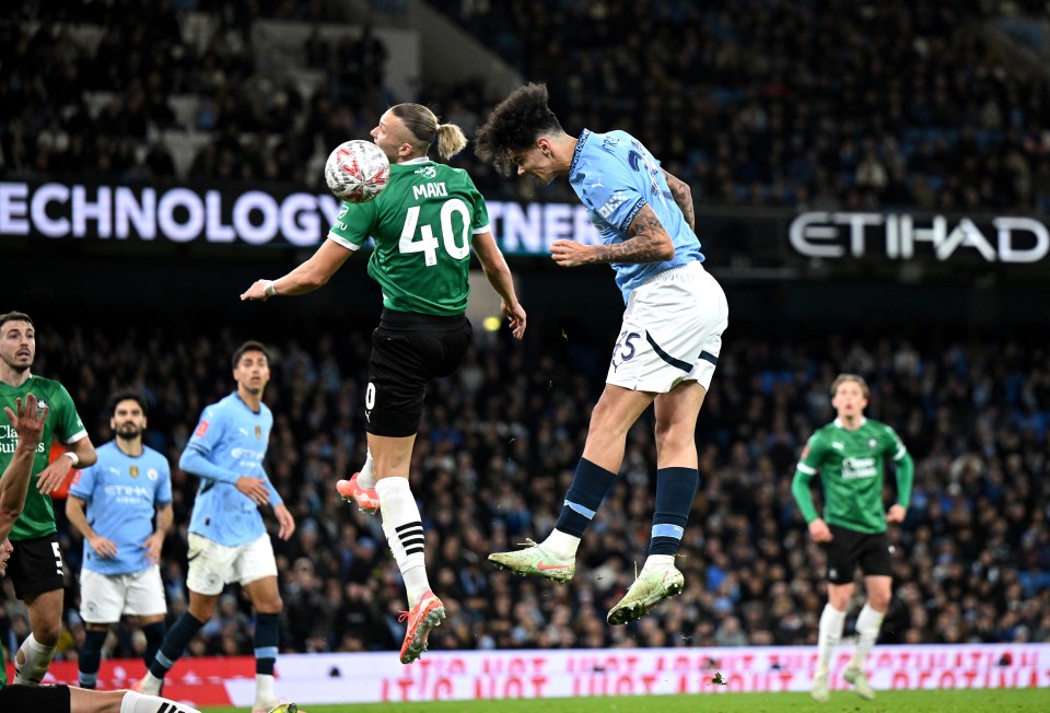 Nico O'Reilly of Manchester City heading the ball.