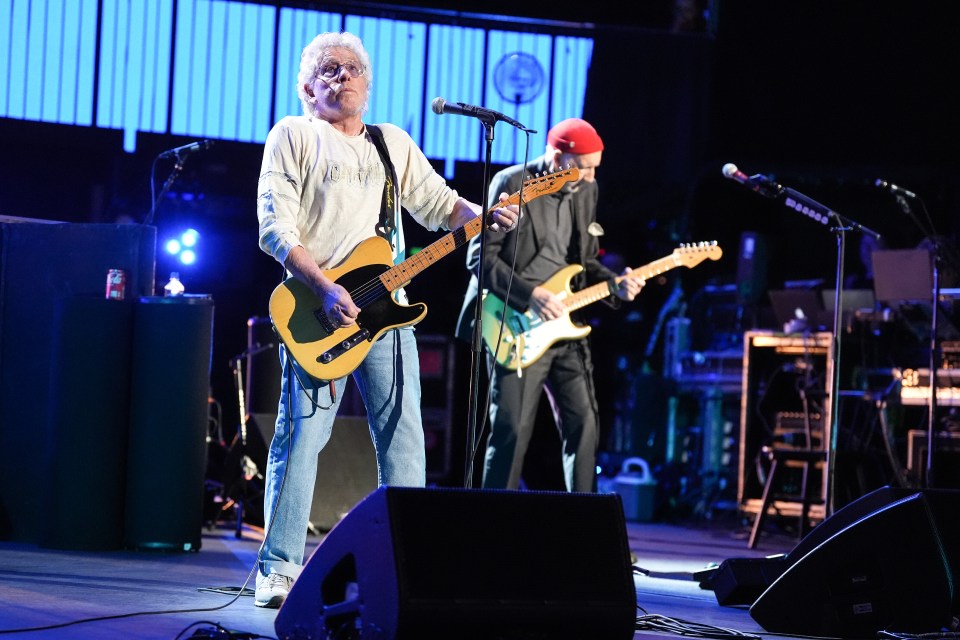 Pete Townshend and Roger Daltrey of The Who performing onstage.