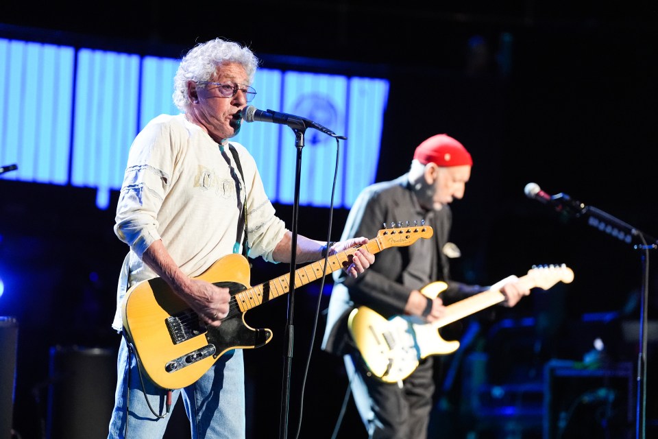 Pete Townshend and Roger Daltrey of The Who performing on stage.