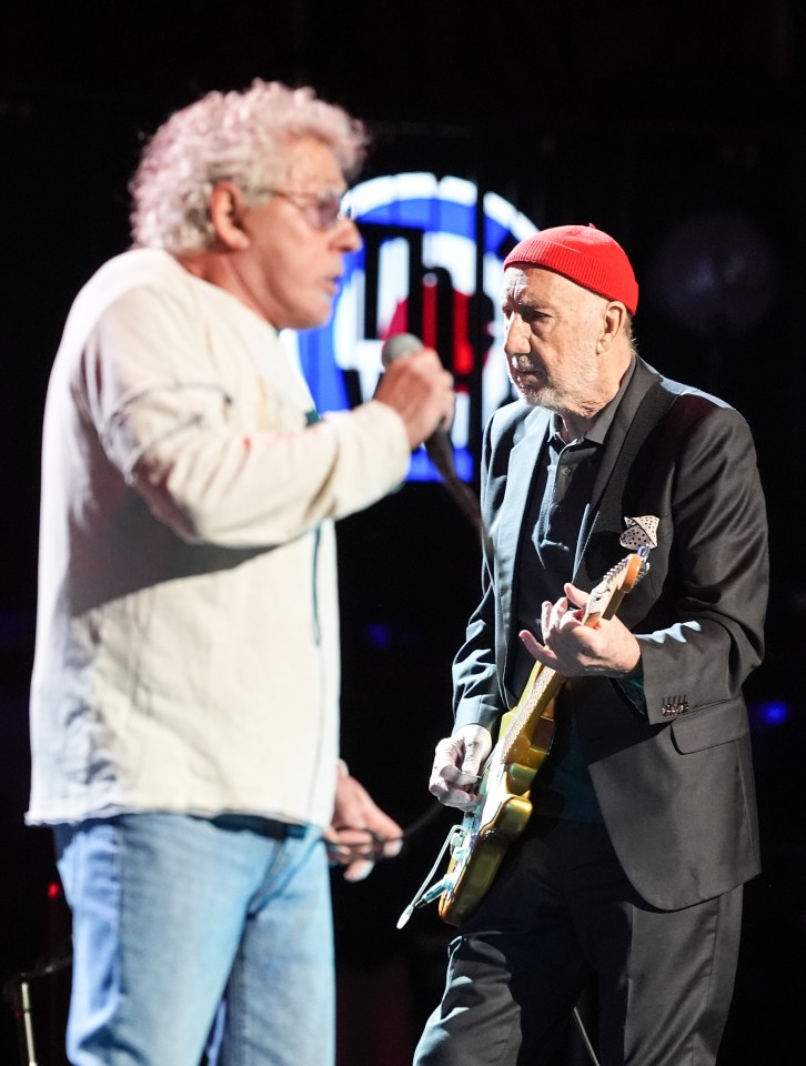 Pete Townshend and Roger Daltrey of The Who performing on stage.