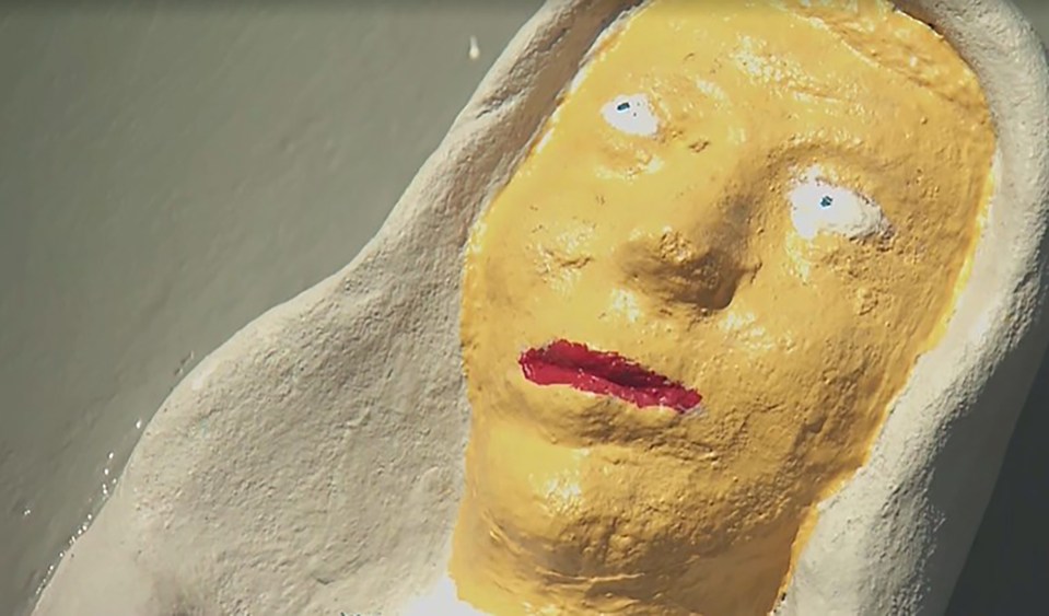 Close-up of a statue's face after renovation.