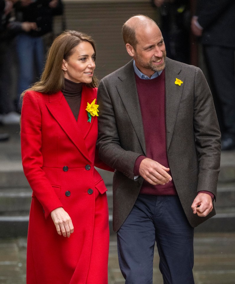 Prince William and Catherine, Princess of Wales, leaving a market in Wales.