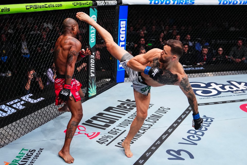 Mauricio Ruffy of Brazil kicking King Green in a UFC lightweight fight.