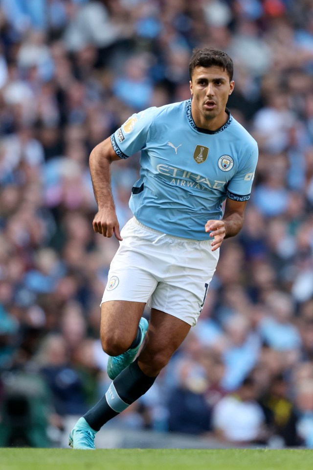 Rodri of Manchester City running during a Premier League match.