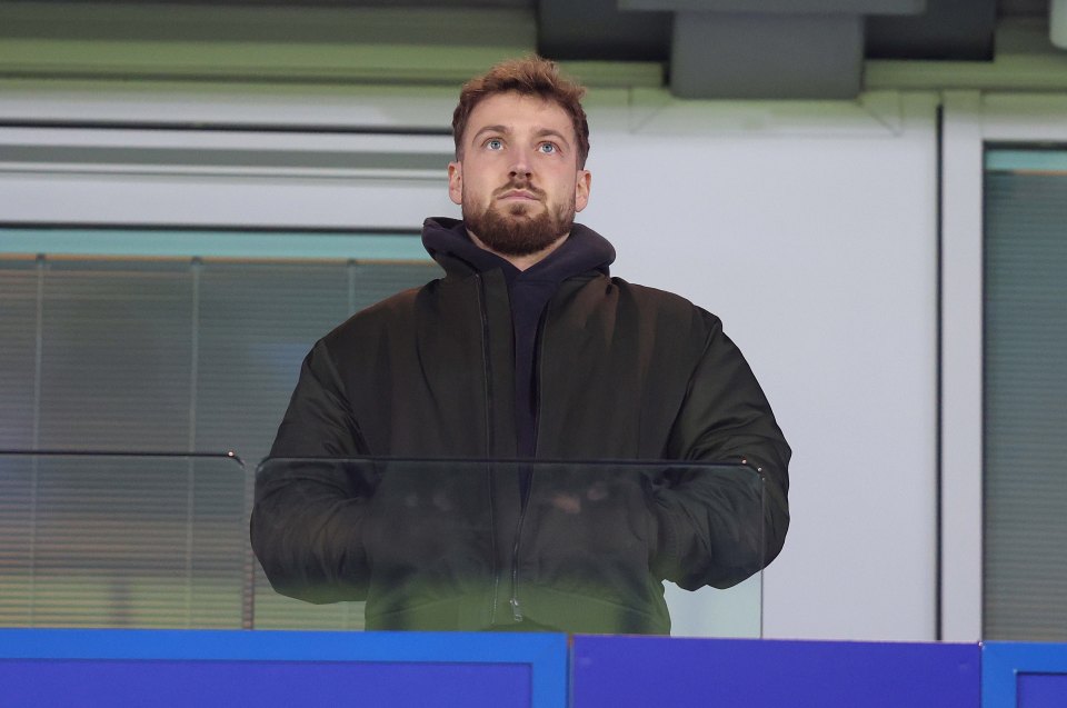 Sam Thompson watching a Premier League soccer match.