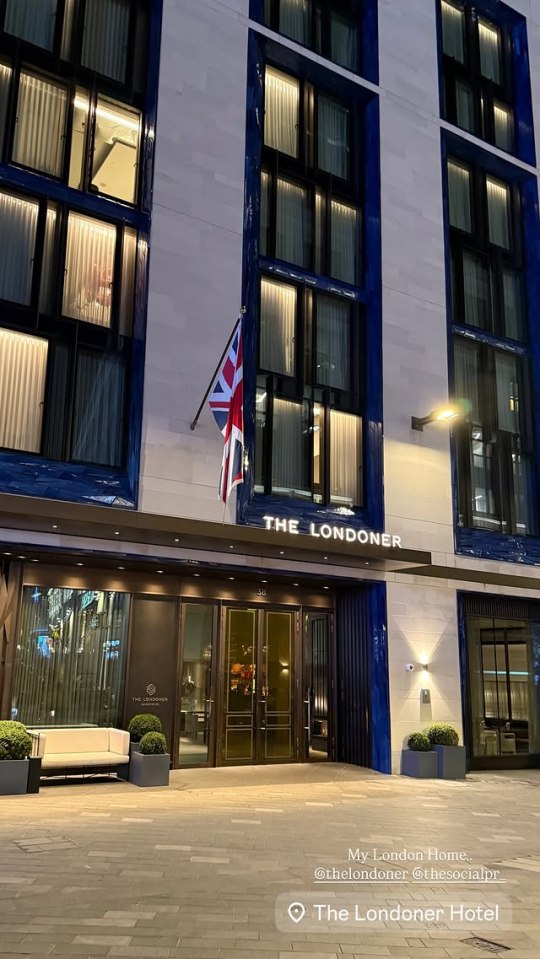 The Londoner Hotel entrance at night.
