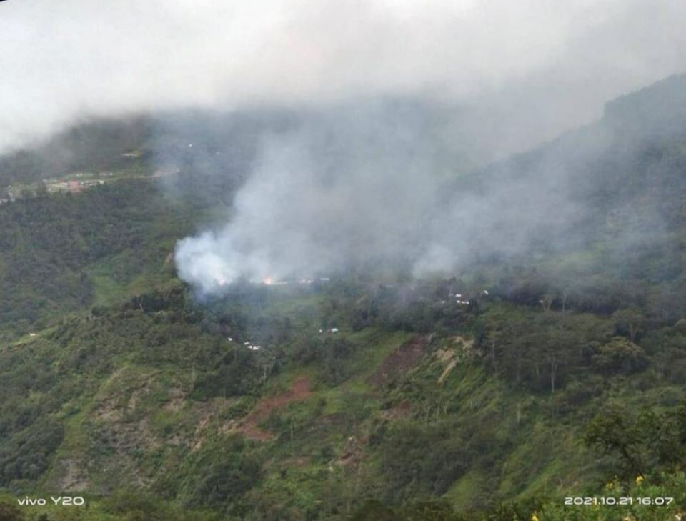 Smoke rises from highlands after an aerial attack.