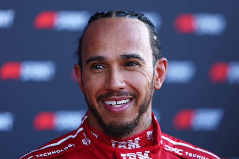 Lewis Hamilton smiling in parc ferme.