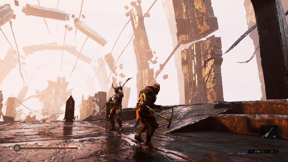 Screenshot of two armored figures in a video game, standing on a platform amidst crumbling structures.