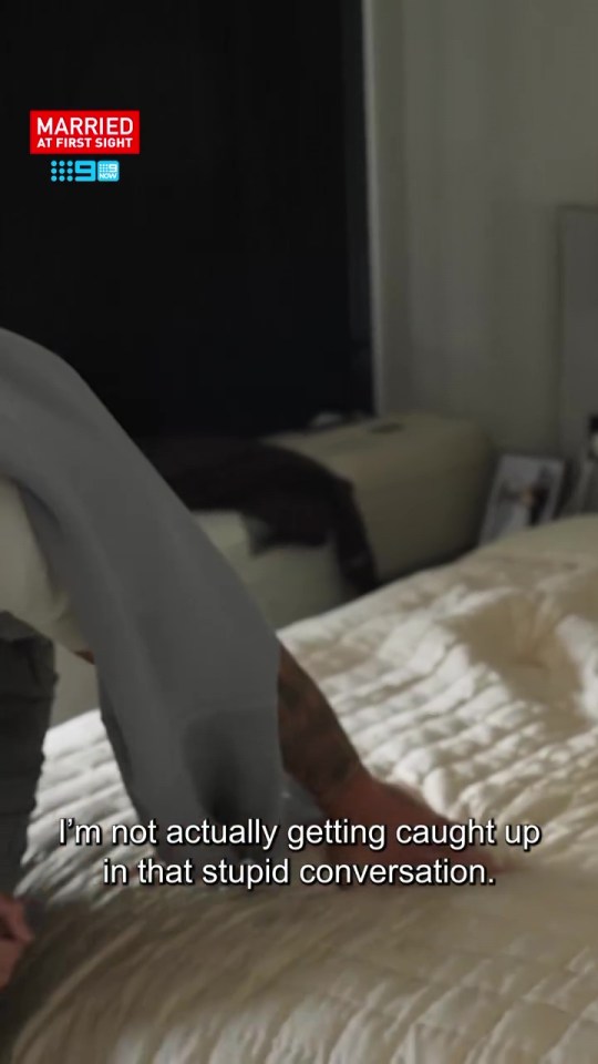 Screenshot from Married at First Sight showing a man on a bed saying, "I'm not actually getting caught up in that stupid conversation."