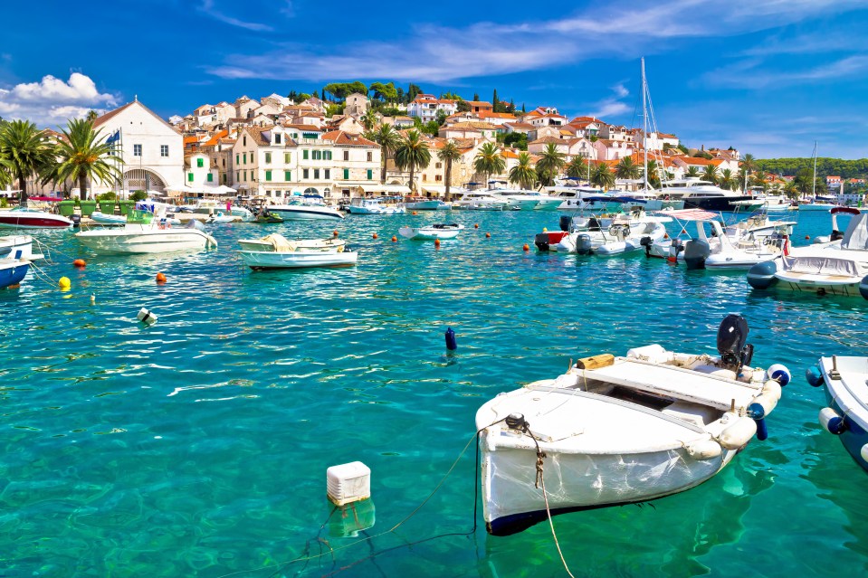 Hvar Island harbor with boats and buildings.