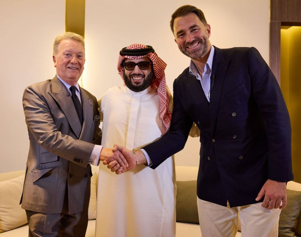 Frank Warren, Turki Alalshikh, and Eddie Hearn shaking hands.