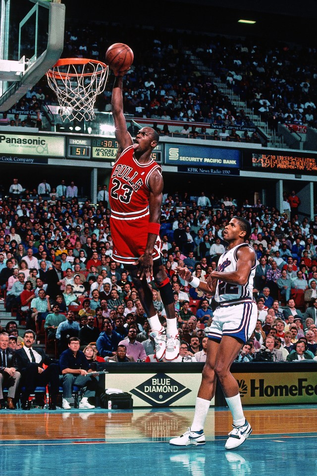Michael Jordan dunking during a Chicago Bulls game.