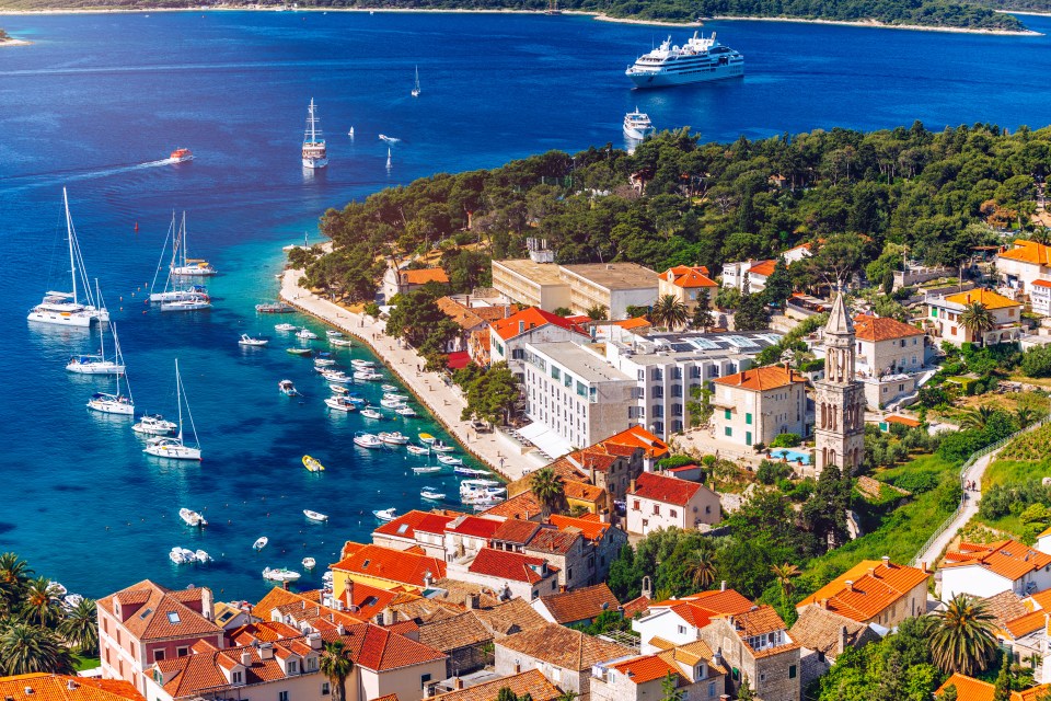 Aerial view of Hvar town, Croatia, with boats in the harbor.