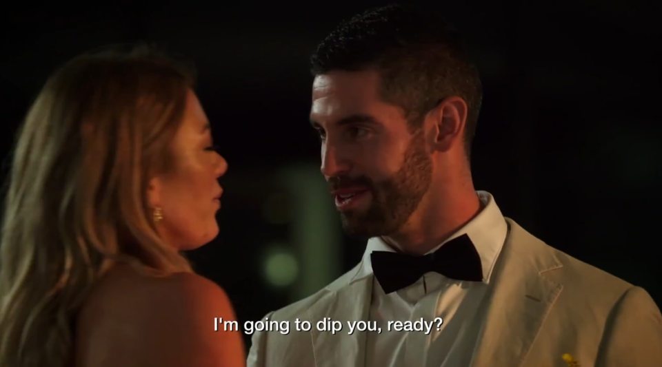 A groom telling his bride, "I'm going to dip you, ready?" shortly after their wedding.