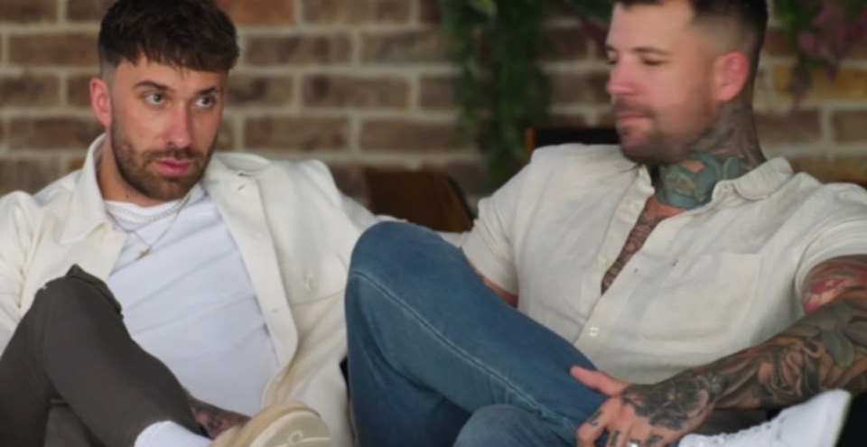 Two men sitting and talking.