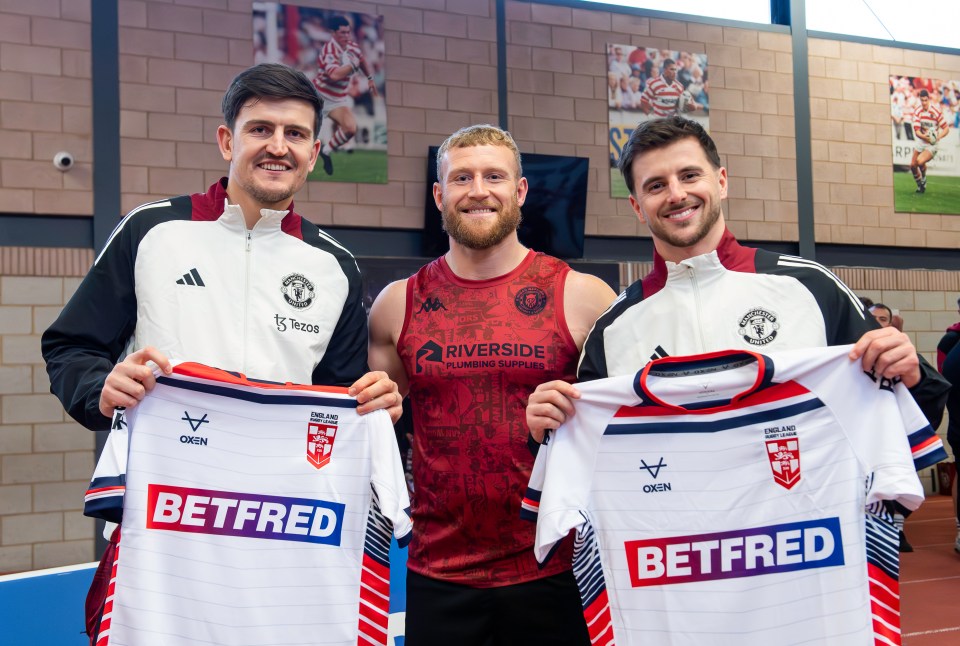 Manchester United players Harry Maguire and Mason Mount with Wigan Warriors rugby league player Luke Thompson.