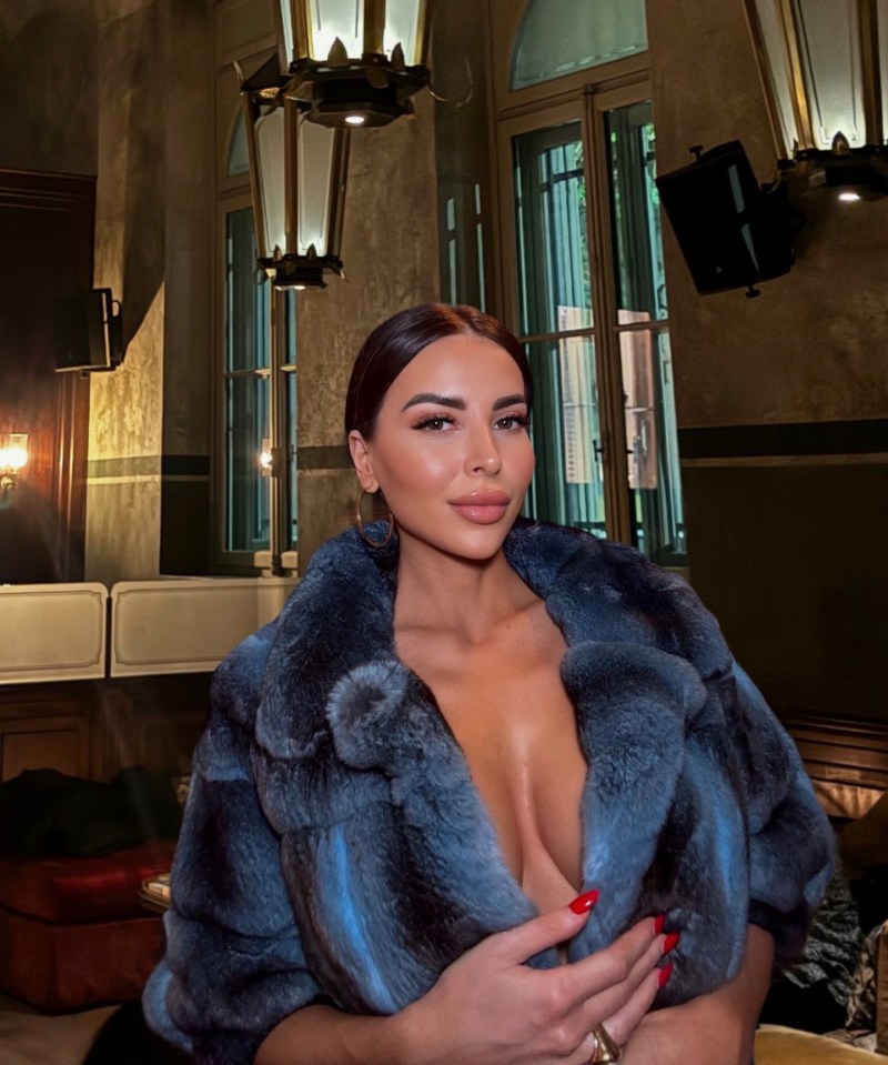 Woman in a blue fur coat.