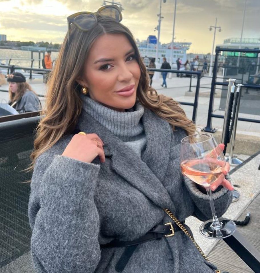 Laura Vaughan of Married At First Sight holding a glass of rosé.