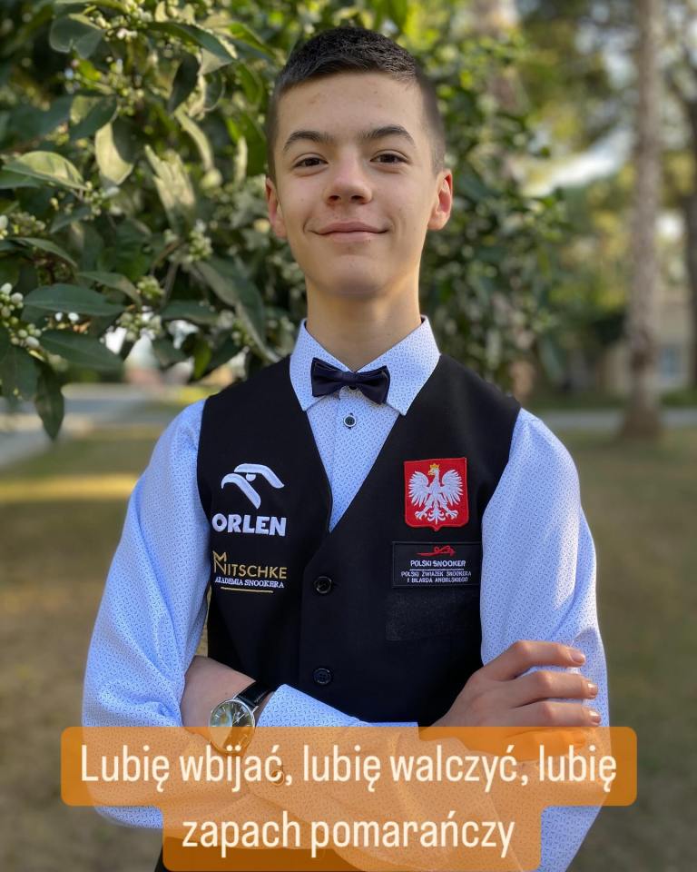 Portrait of a young man in a snooker vest.