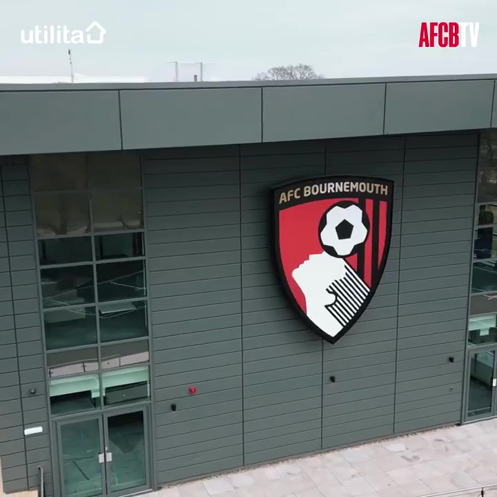 AFC Bournemouth training centre building with club logo.