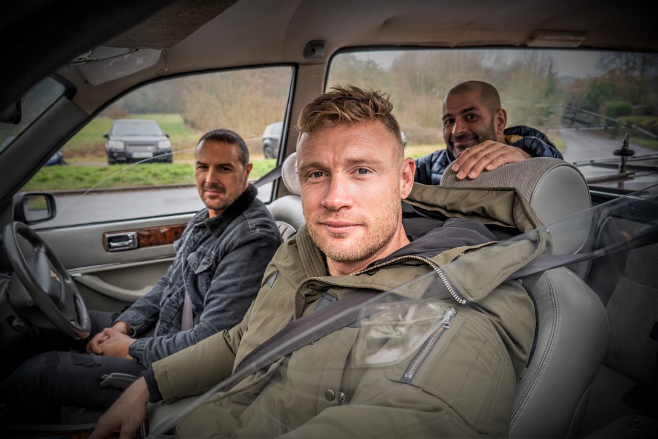 Three men in a car.