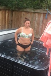 Woman in a hot tub.
