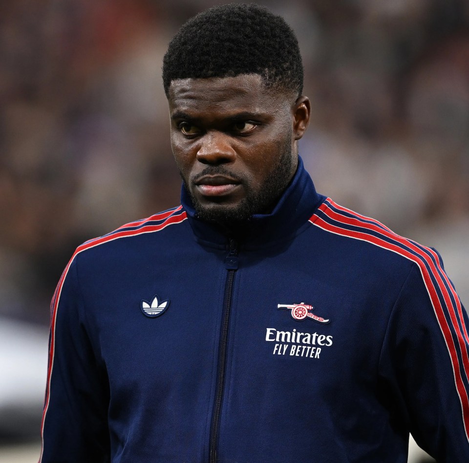 Thomas Partey of Arsenal in a navy tracksuit.