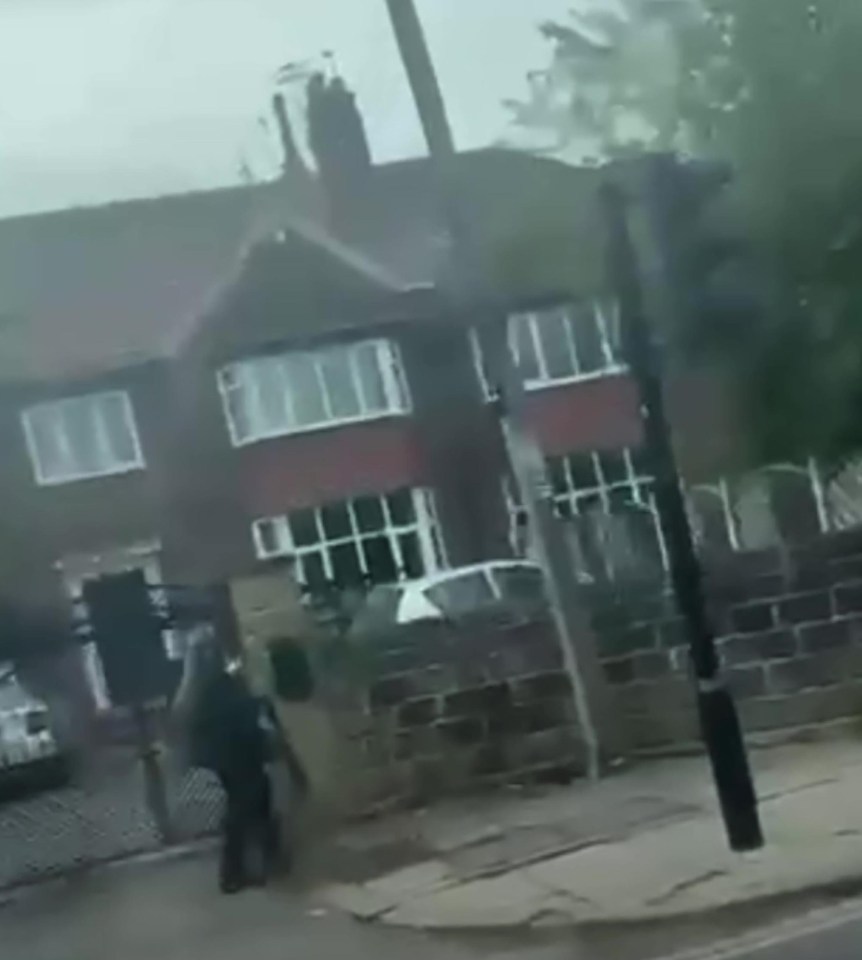 Chilling moment 'crossbow attacker' seen wielding weapons through streets of Leeds as three injured in broad daylight