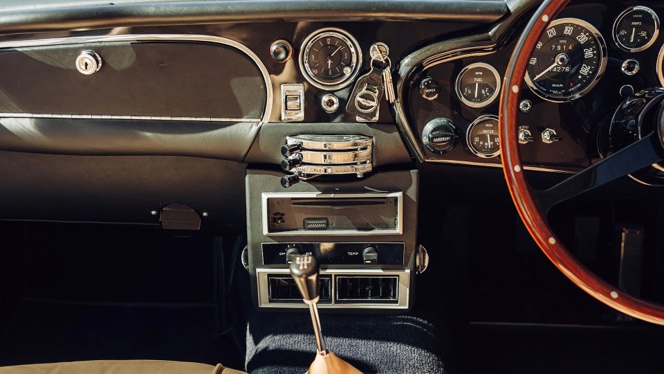 Interior view of a 1964 Aston Martin DB5 dashboard.